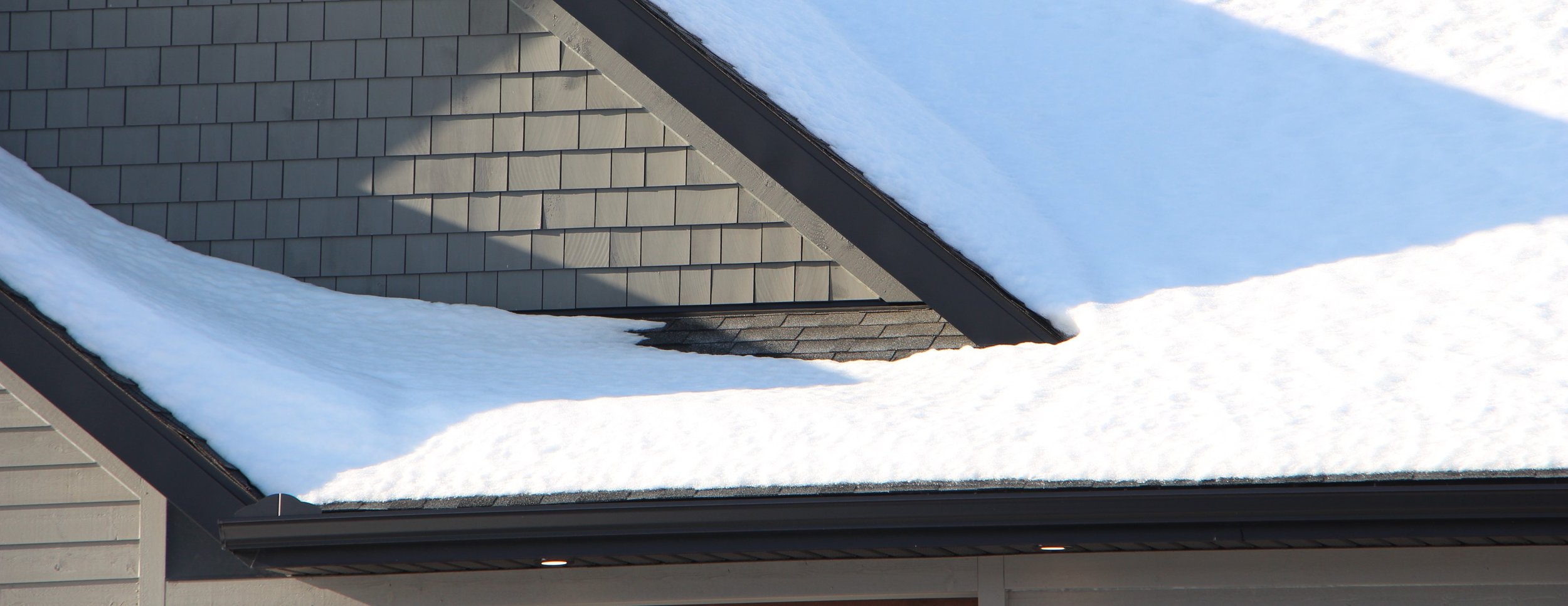 House with snow on gutters